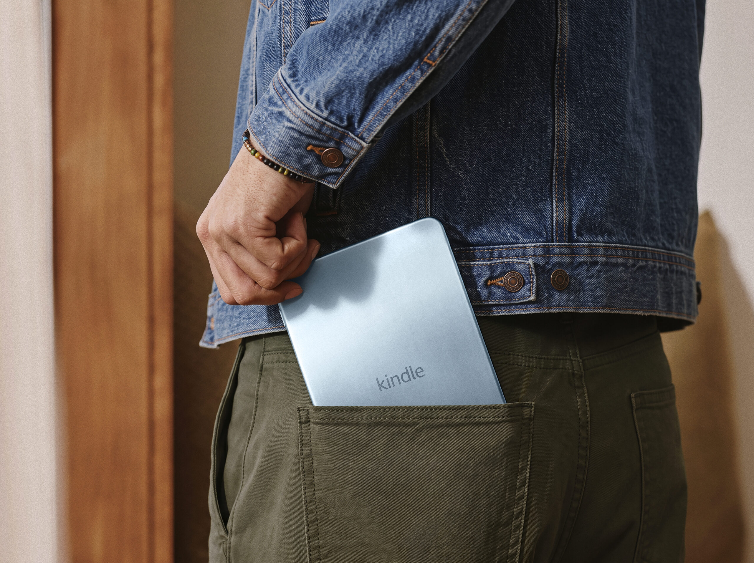 The compact Kindle fitting into a pocket