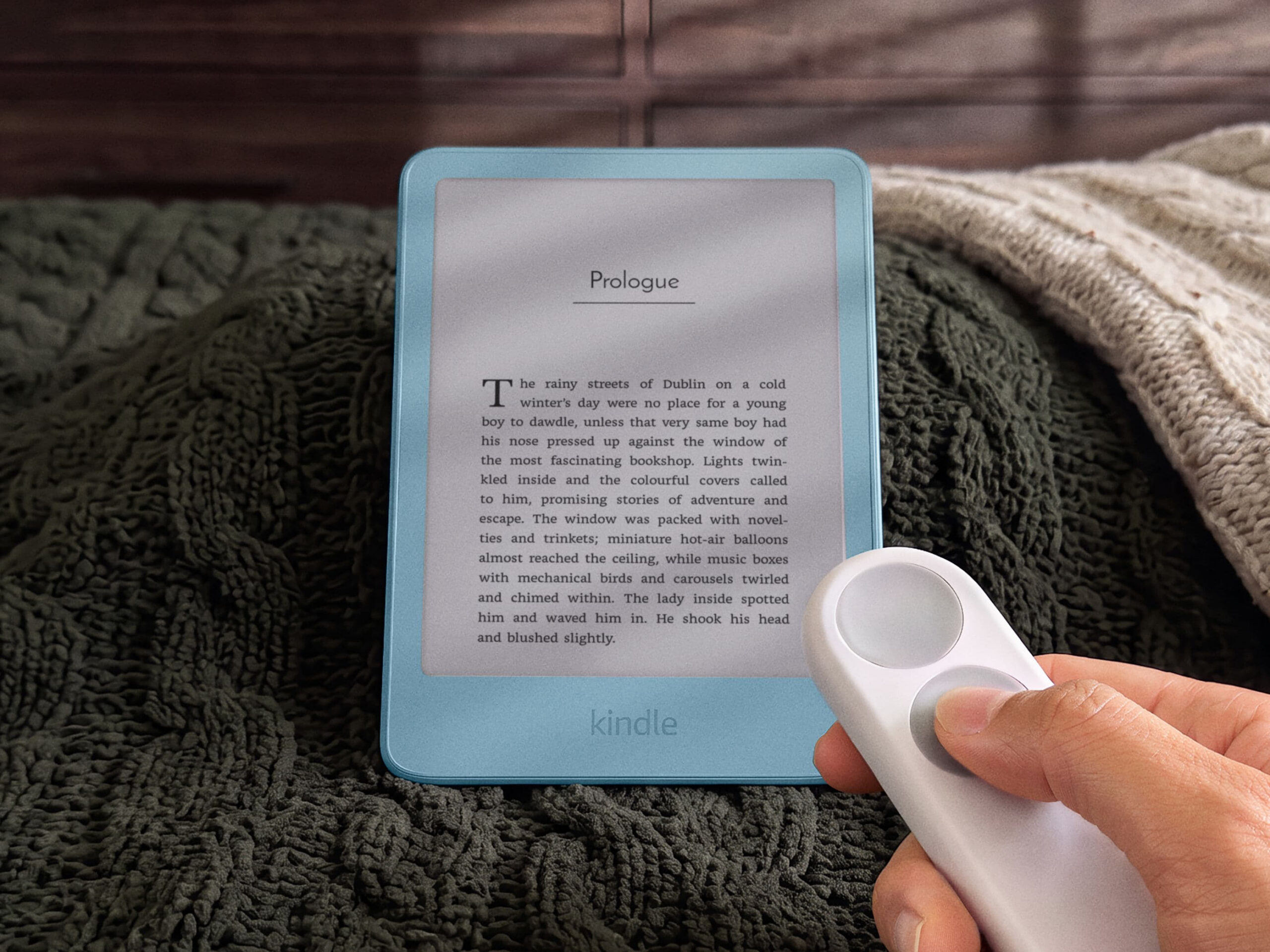 Kindle Click wireless page-turn remote shown with the Kindle; accessory sold separately